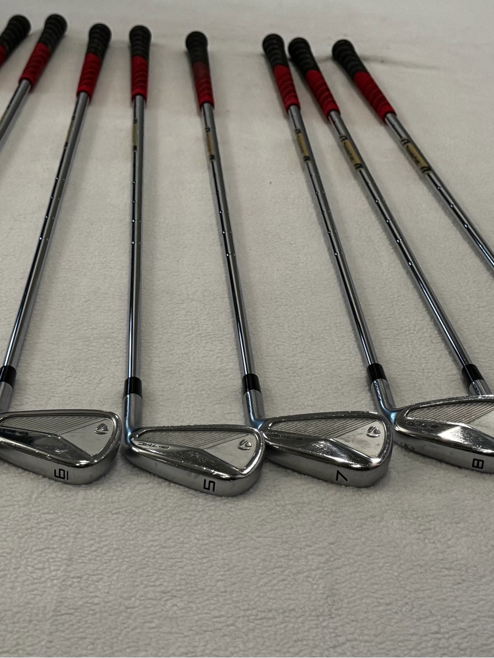 TaylorMade Chrome Iron Set with Red and Black Grips